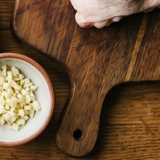A wooden chopping board on an oak worktop